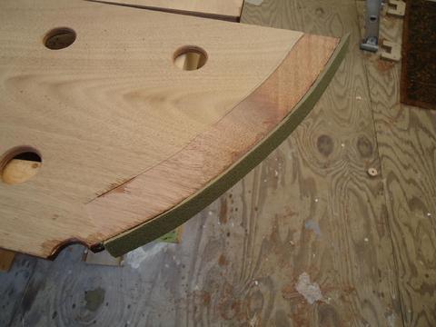 I use contact cement to secure the foam wedge to the edge of the divider. The endgrain has two coats of epoxy.